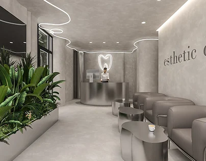 The clinic reception: brushed steel desk, grey lounge seating, plants and a neon sign on a stone wall